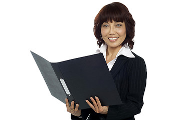 Image showing Young female asian boss going through the file