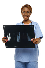 Image showing Medical expert holding patients x-ray report