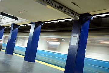 Image showing Blue line train in motion