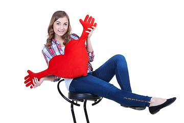 Image showing Beautiful girl with A red plush heart