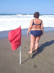 Image showing Overweight woman on a beach