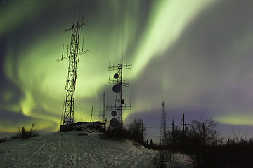 Image showing SCientific antennas under night sky with northern lights
