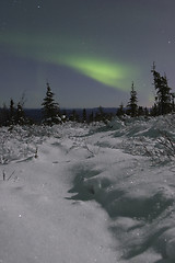 Image showing Northern lights over moonlight landscape