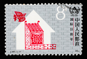 Image showing A stamp printed in China shows International Year of shelter
