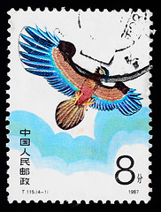 Image showing A stamp printed in China shows a kite of eagle figure  in the sky