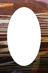 Image showing old rusty tin wall detail and white oval in center 