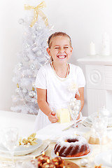 Image showing Happy girs helping set the table