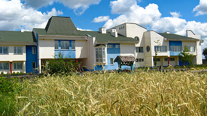 Image showing School on a background of a field with wheat