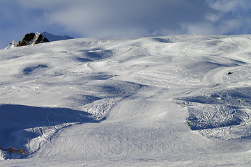 Image showing Snow skiing piste in evening