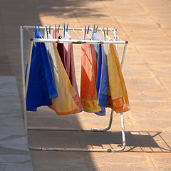 Image showing Colorful towels on dryer