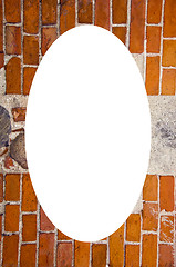 Image showing red brick stones wall and white oval in center 