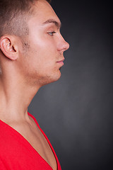 Image showing side view of a young casual man