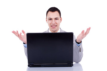 Image showing business man welcoming at desk