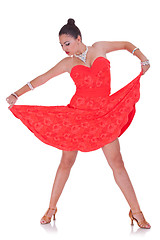 Image showing woman dancer pulling her nice red dress