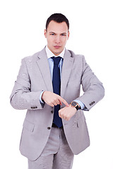 Image showing man impatiently pointing to his watch