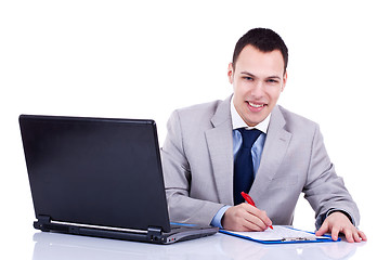 Image showing business man signing some papers