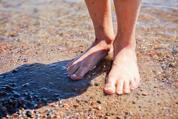 Image showing Feet in water