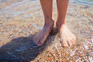 Image showing Feet in water