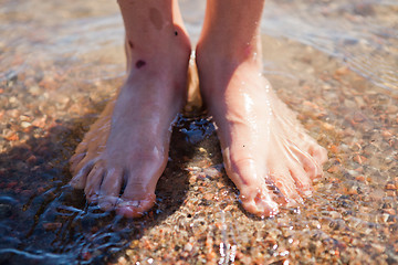 Image showing Feet in water