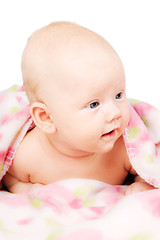 Image showing Little baby under multicolored towel