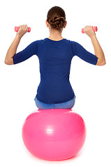 Image showing Exercises with dumbbells on a gymnastic ball