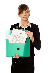 Image showing green suitcase with contracts