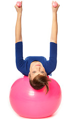 Image showing Exercises with dumbbells on a gymnastic ball