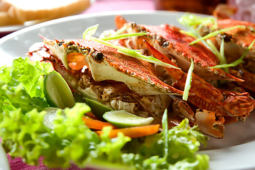 Image showing three large red crabs with salad and lime