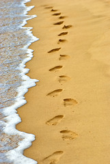 Image showing human footprints on sand at the beach