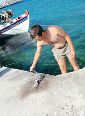 Image showing fisherman with octopus