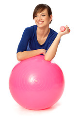 Image showing Exercises with dumbbells on a gymnastic ball