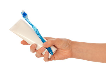 Image showing Toothpaste and blue toothbrush