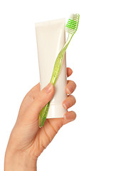 Image showing Toothpaste and green toothbrush