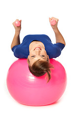 Image showing Exercises with dumbbells on a gymnastic ball