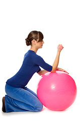 Image showing Exercises with dumbbells on a gymnastic ball