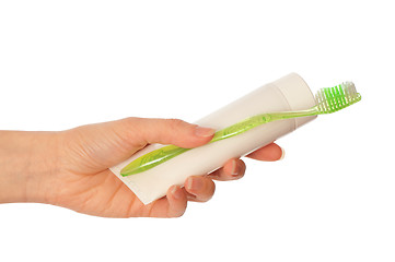 Image showing Toothpaste and green toothbrush