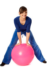 Image showing Exercises with dumbbells on a gymnastic ball