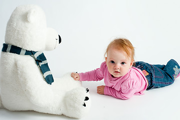 Image showing Baby girl with bear toy