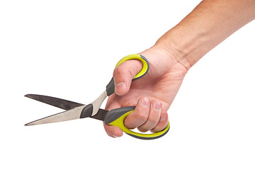 Image showing Hand is holding scissors isolated