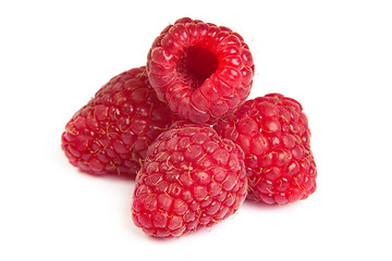 Image showing Group of some raspberries on a white background. Close up macro 