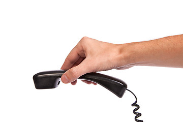 Image showing Hand holding an old black telephone tube