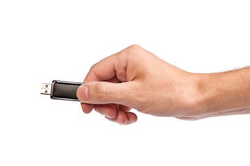 Image showing Closeup image: hand holding black USB data storage or connecting