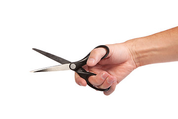 Image showing Hand is holding scissors isolated