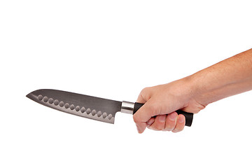 Image showing Hand is holding a kitchen kinfe isolated