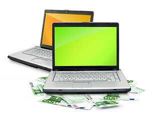 Image showing Open laptop with money 