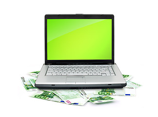 Image showing Open laptop with money 