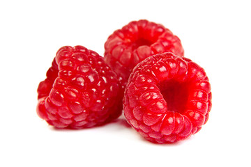 Image showing Three fresh raspberry on a white background. Close up macro shot