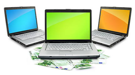 Image showing Open laptop with money 