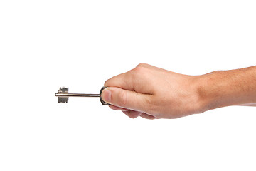 Image showing Male hand holding a key to the house