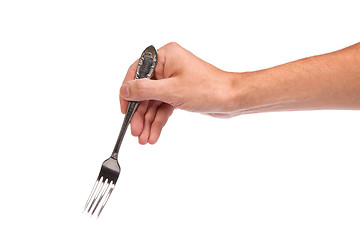 Image showing Right mans hand with empty metallic fork